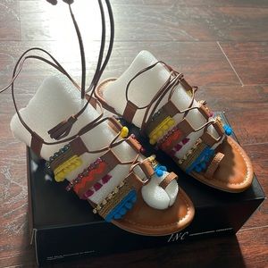 Colorful bedazzled tassel leather sandals